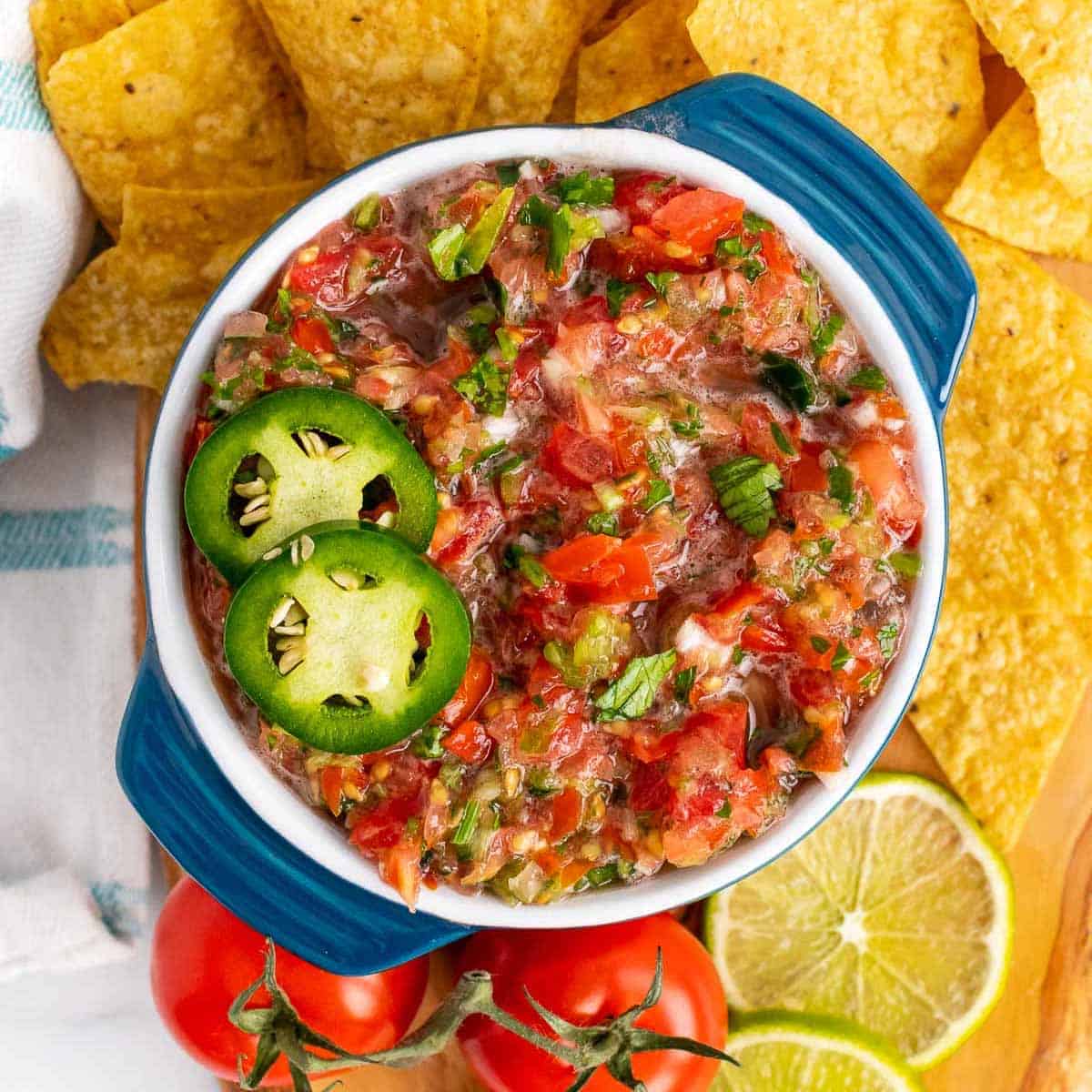 Bowl of low-sodium salsa with sliced jalapenos on top