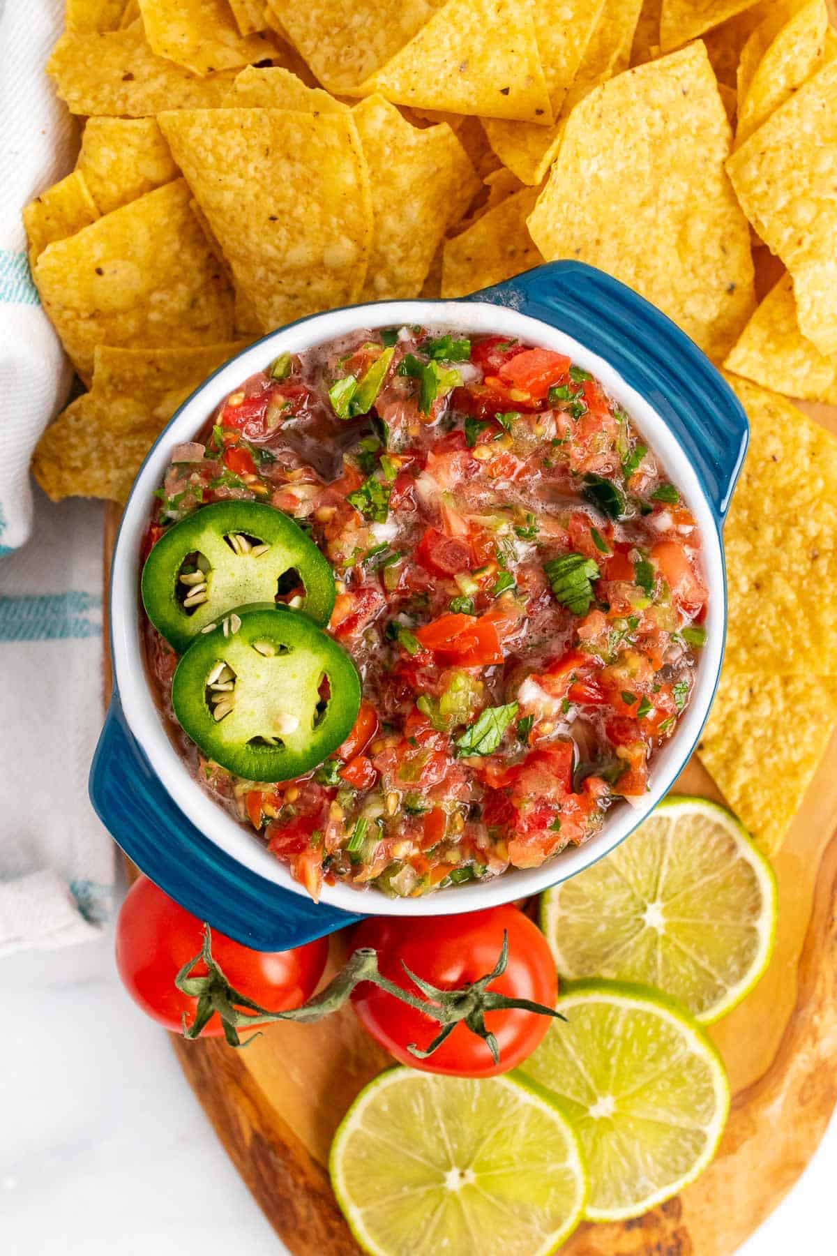 Bowl of homemade low-sodium salsa on bed of nacho chips