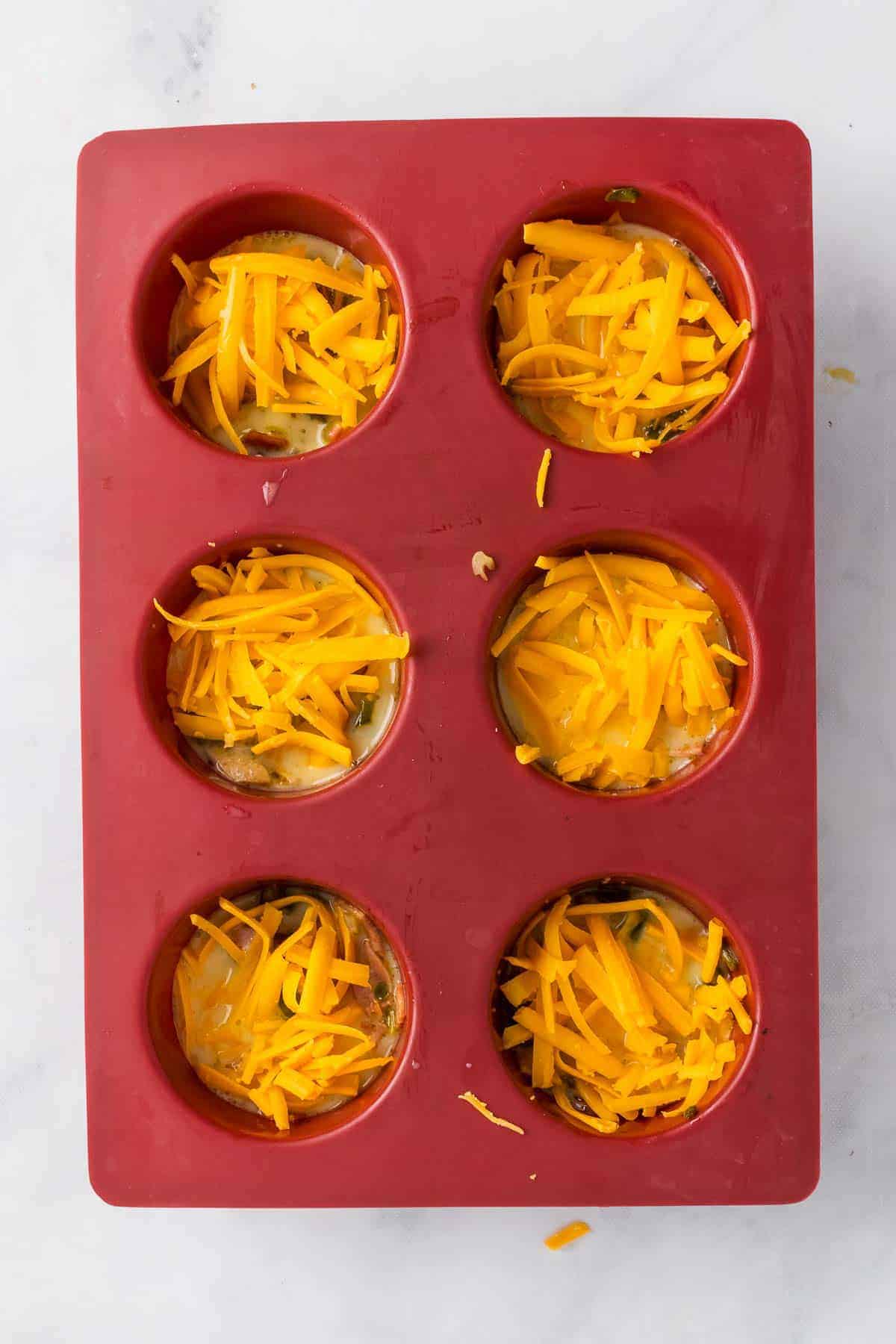 Muffin cups with egg mixture and cheese