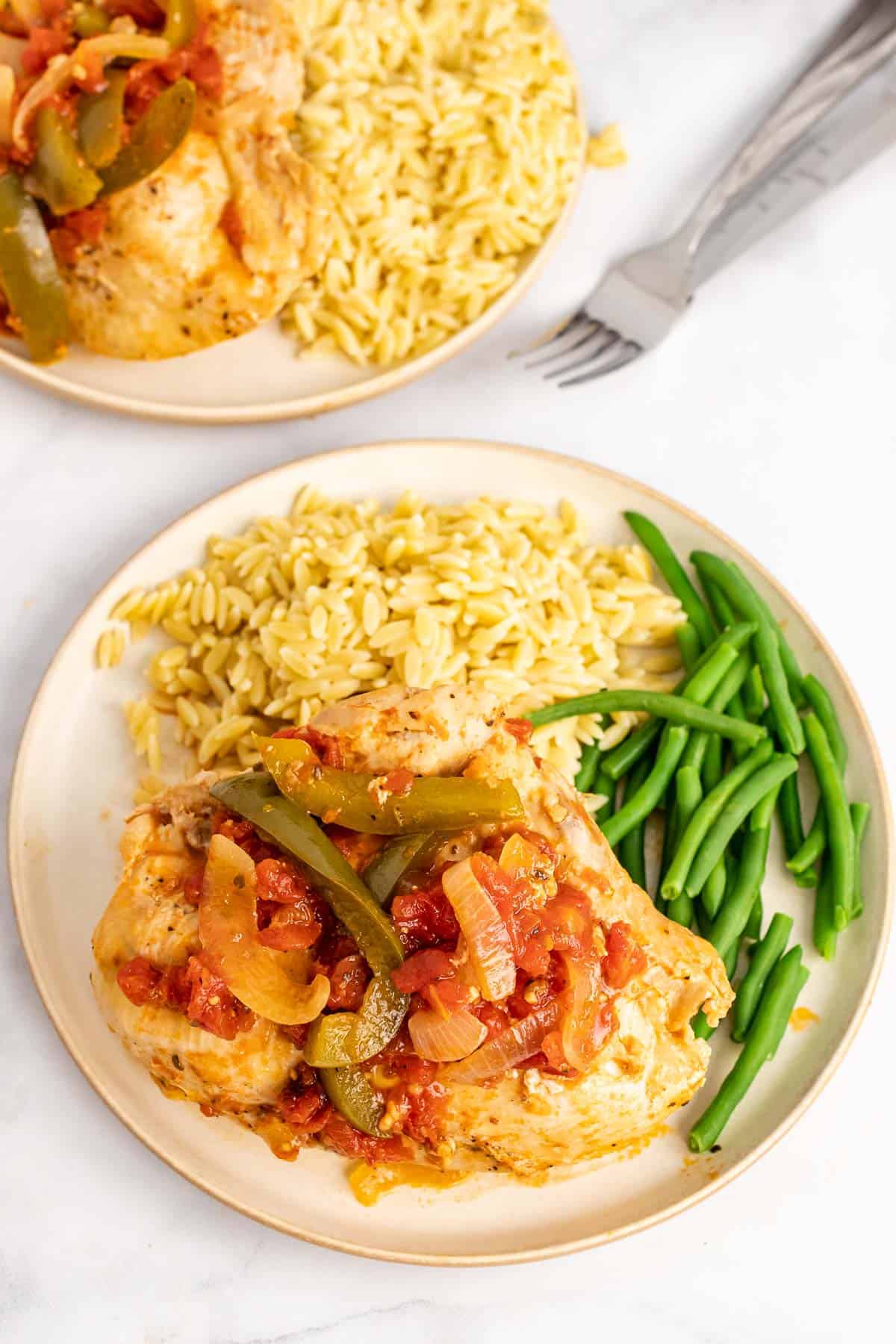 Plate of Chicken Cacciatore with orzo and green beans
