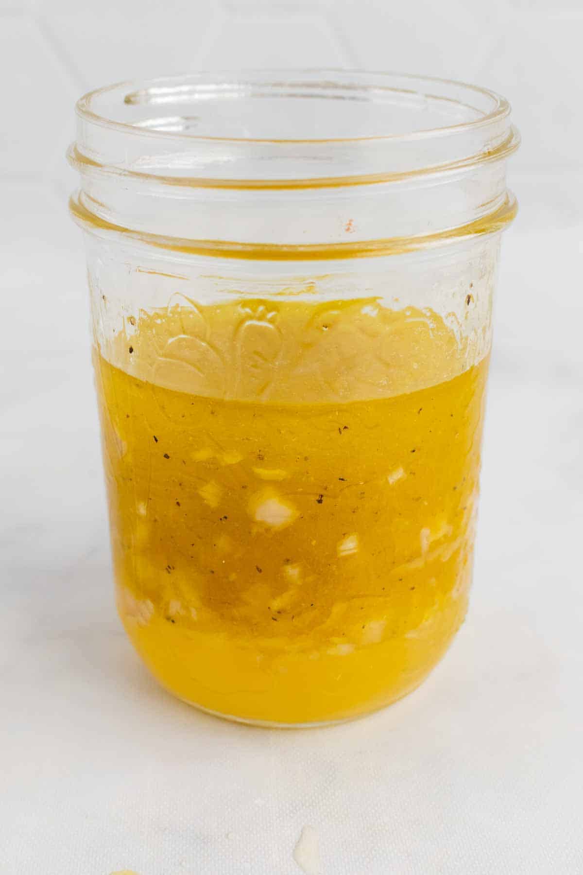 Glass jar with citrus vinaigrette