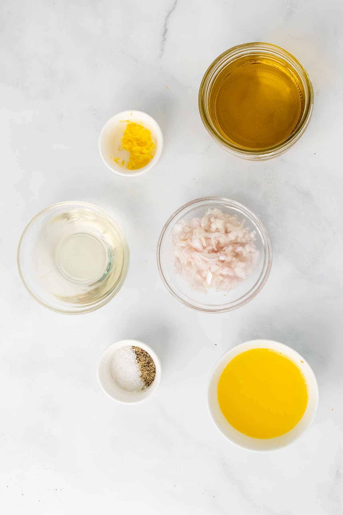 Ingredients for the vinaigrette on a marble surface