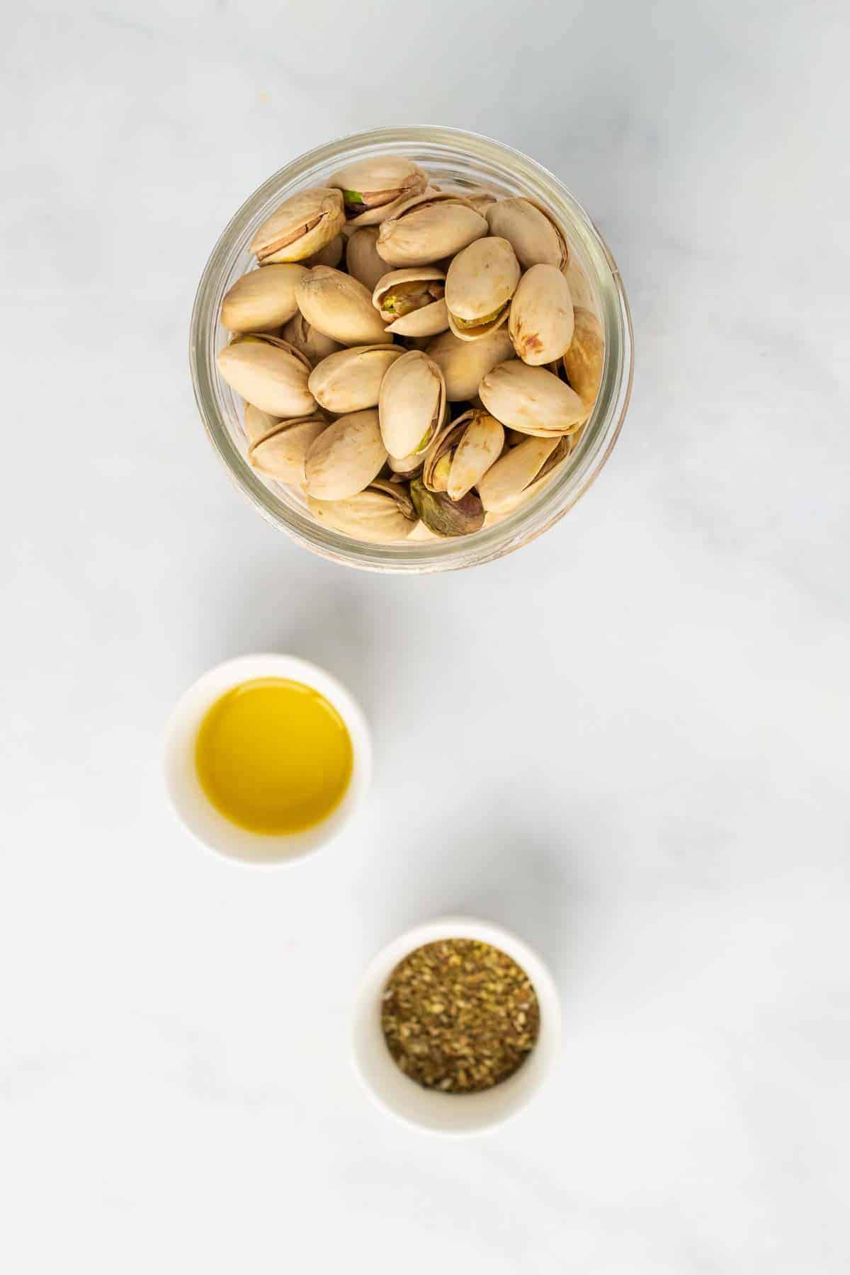 Pistachios, oil, and spices in individual ramekins
