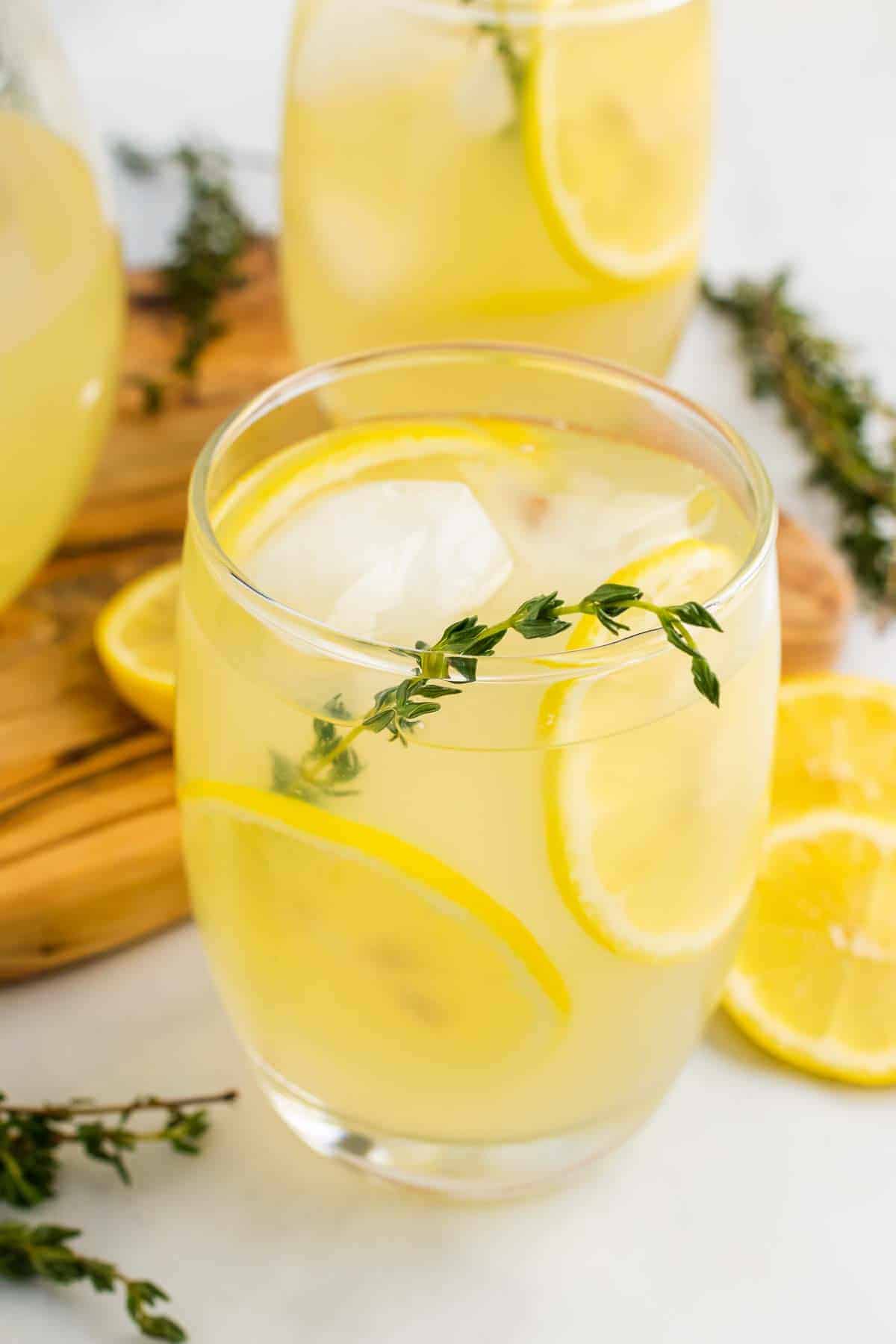 Glass of Sugar-Free Lemonade with Thyme on table