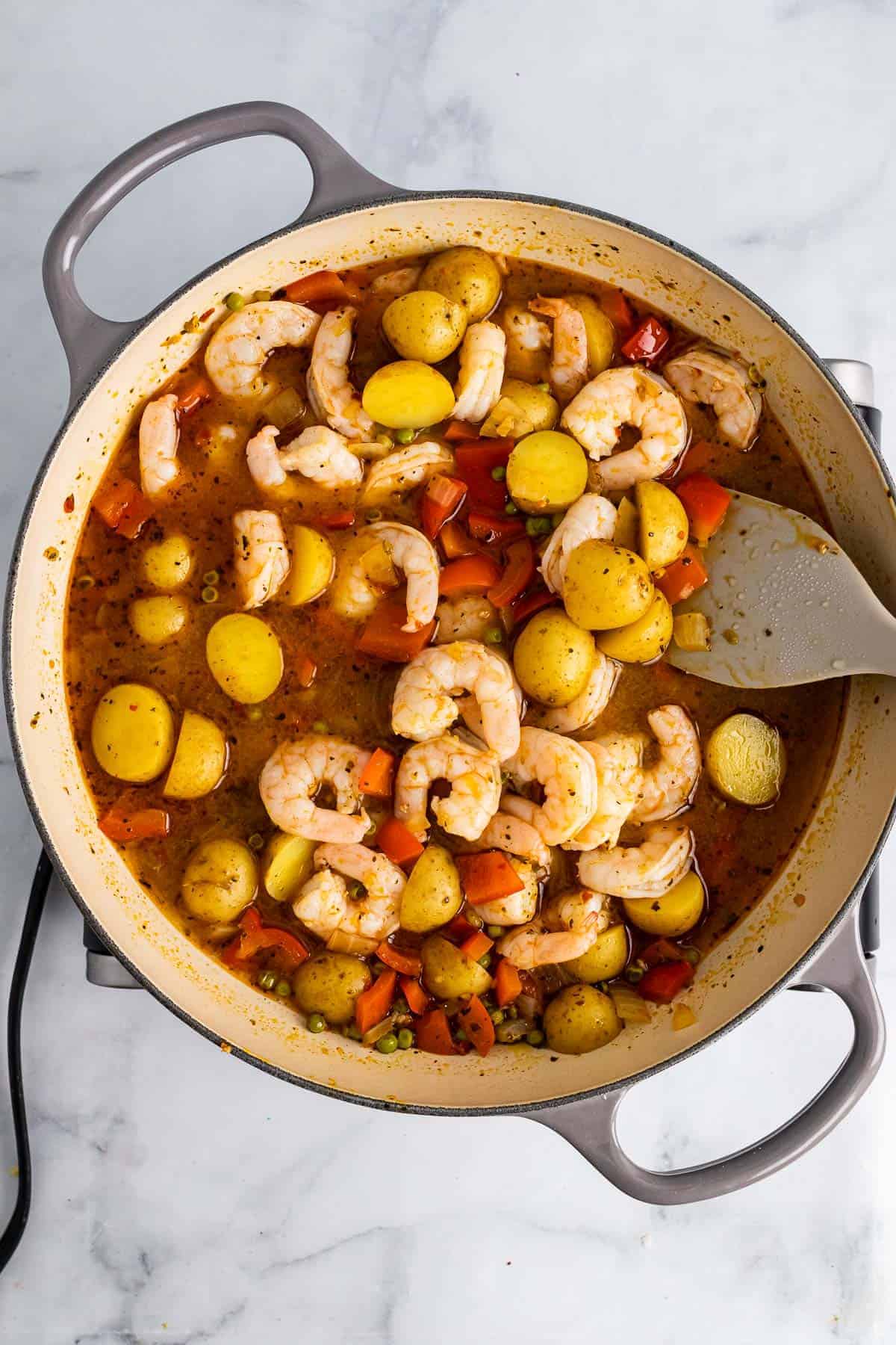 Stew with shrimp in the saucepan as seen from above