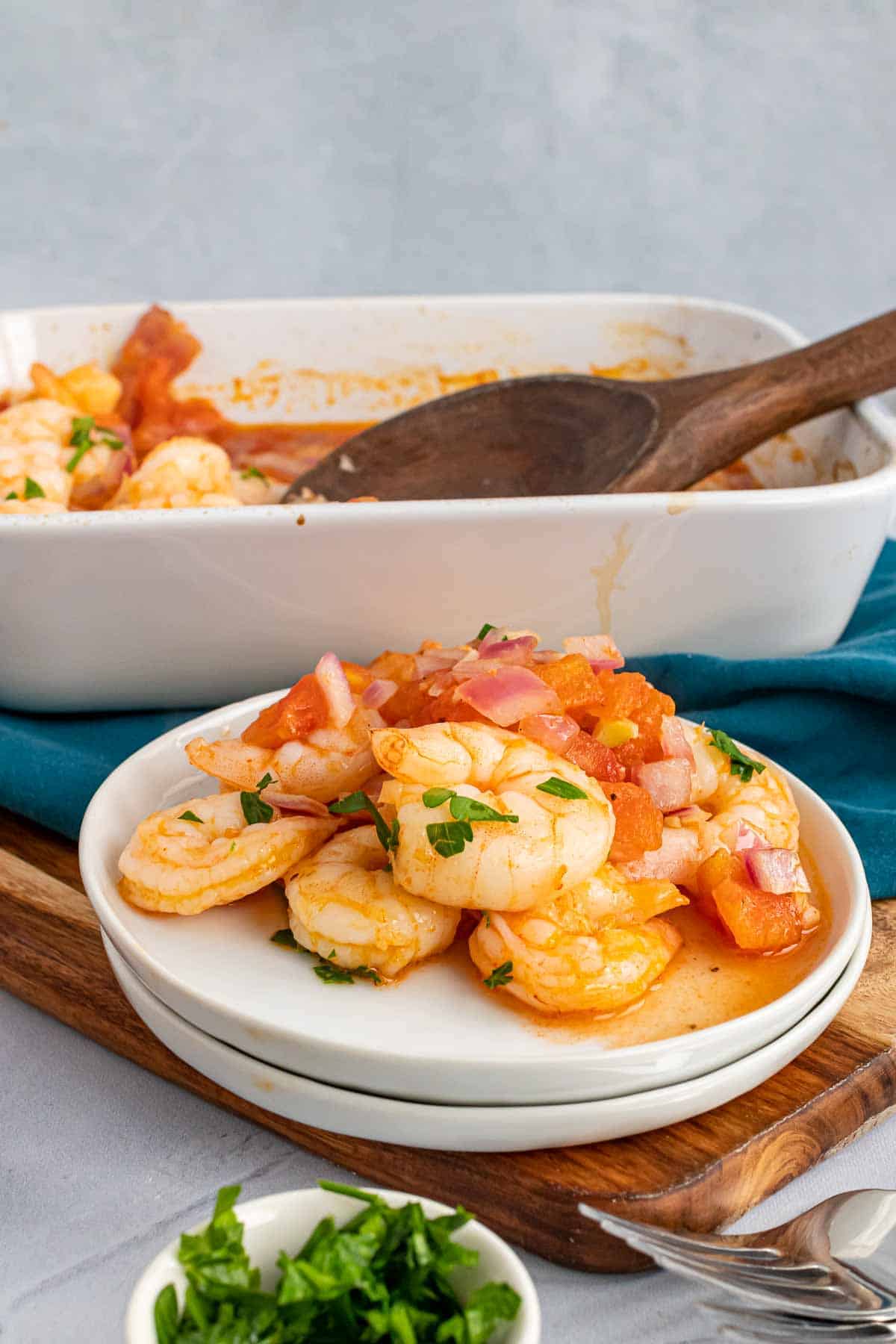 Plate of shrimp in front of the baking dish