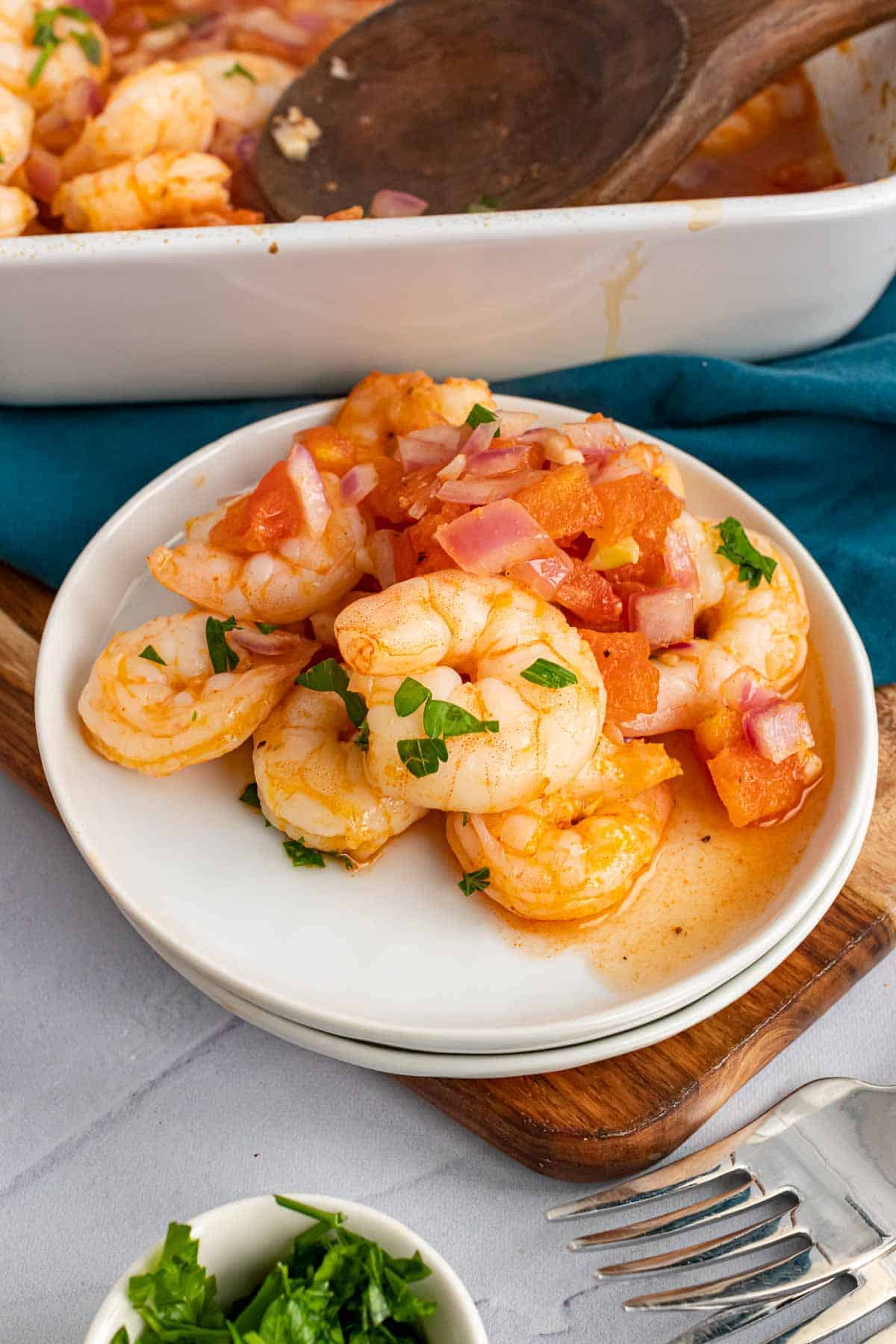 Plate of Garlic and Tomato Roasted Shrimp on table