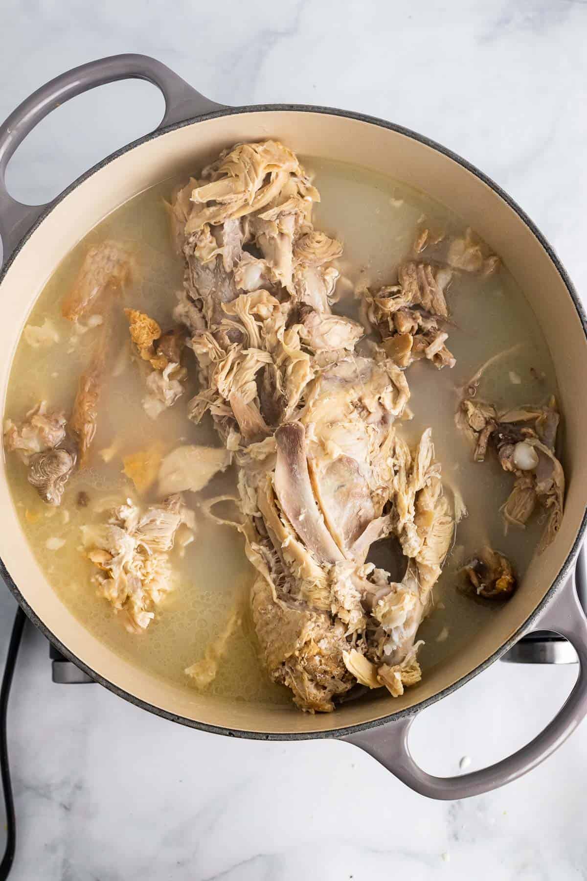 Turkey carcass cooking in pot