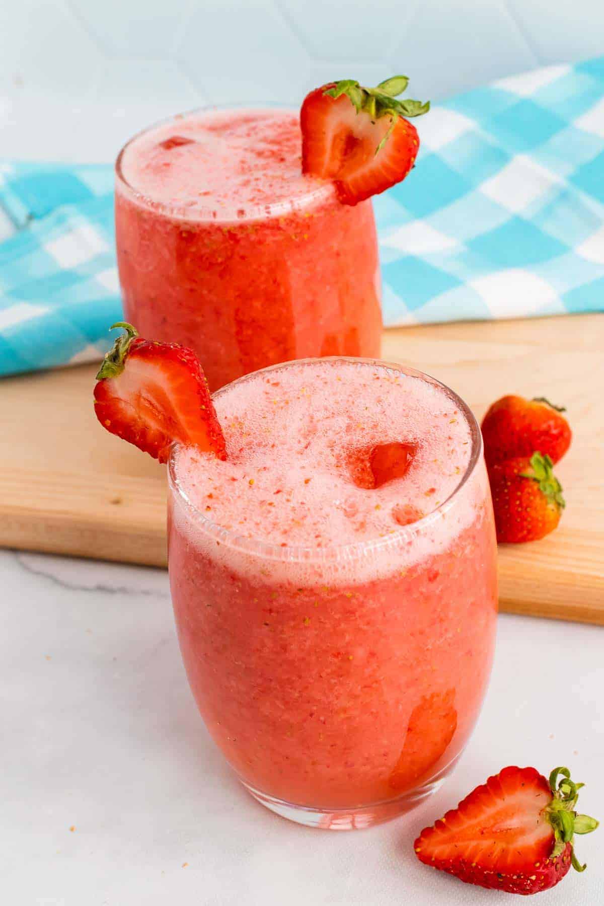 Glass of Strawberry Agua Fresca seen from the side