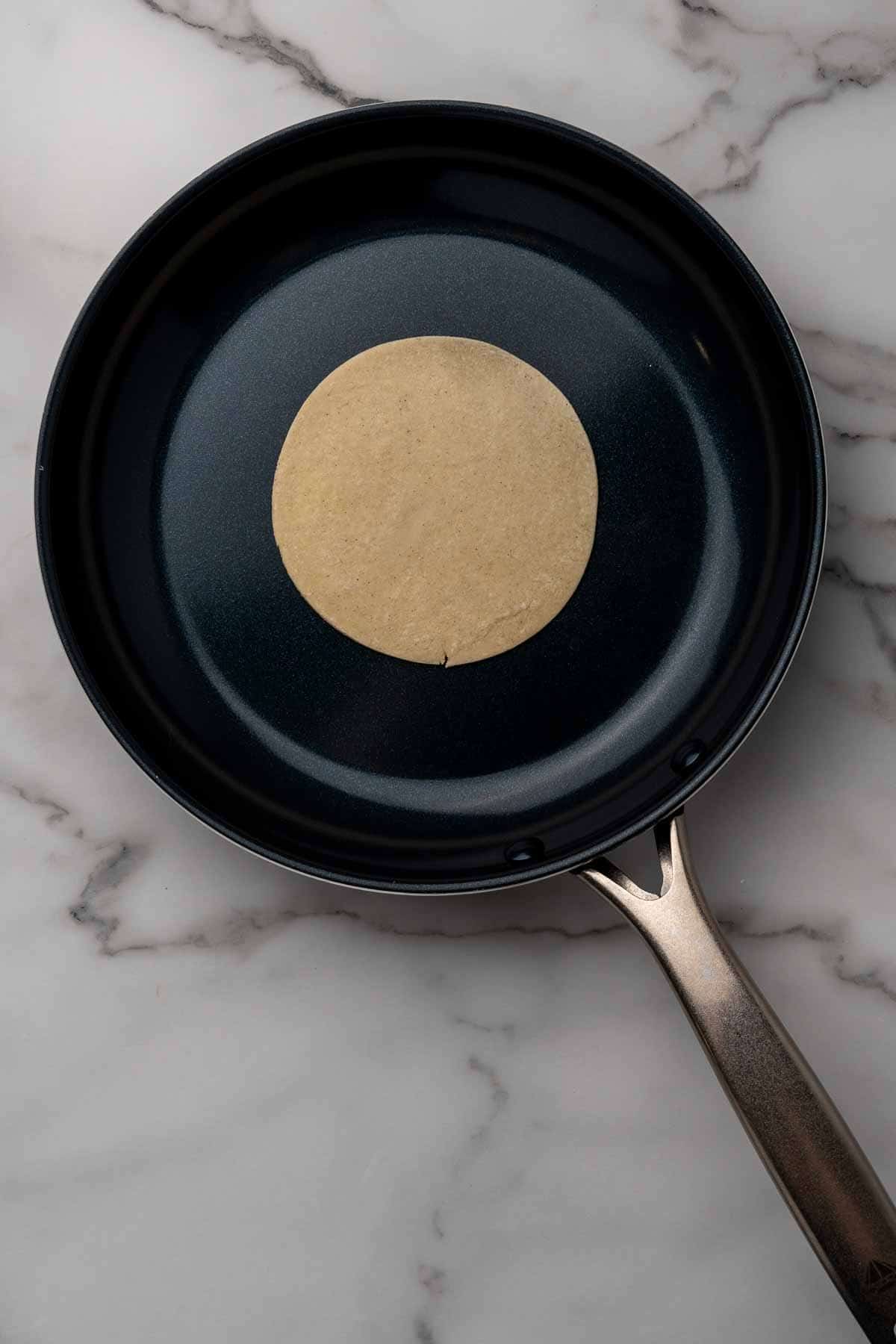 Tortilla cooking on a pan