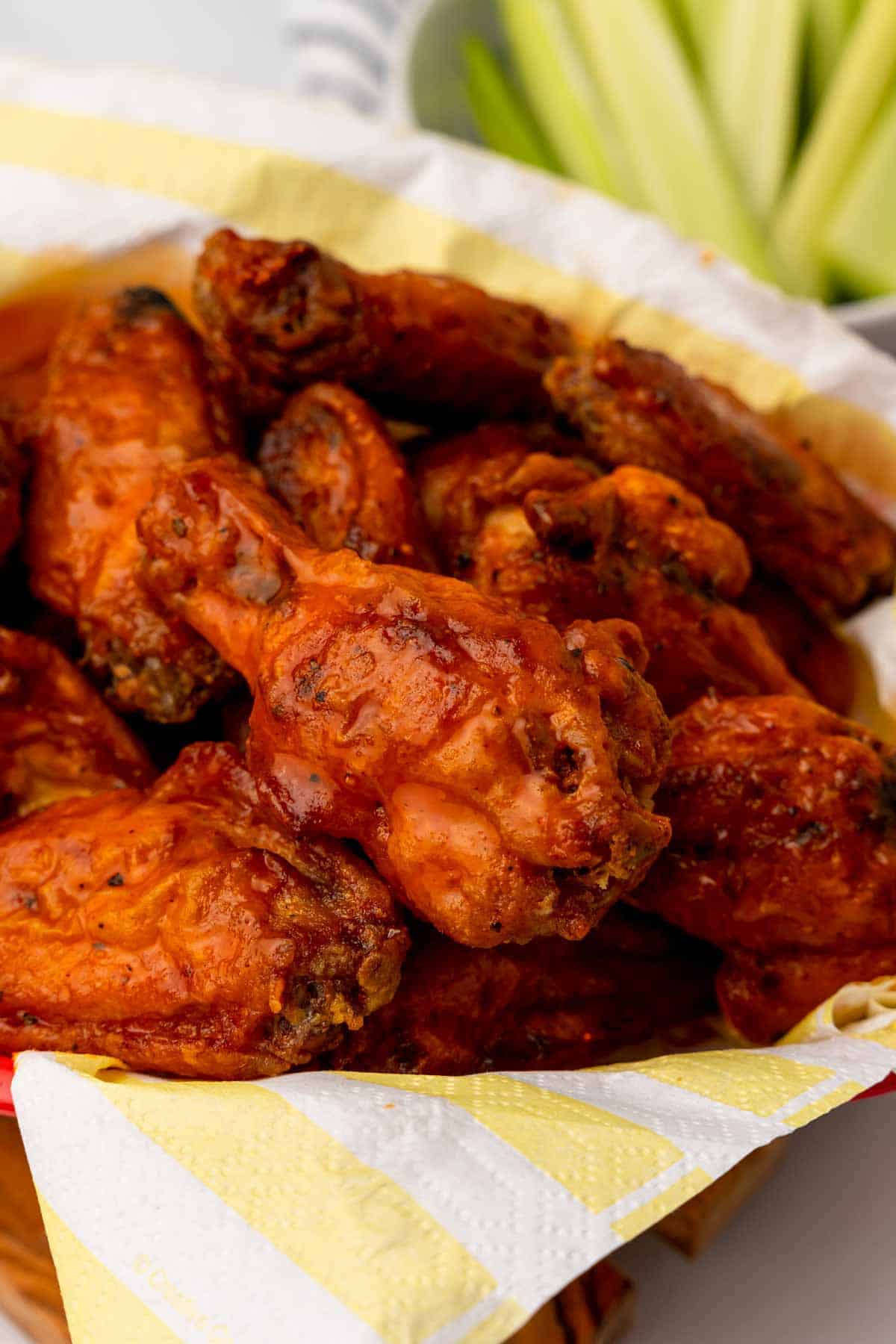 Close-up of chicken wings in a red bowl
