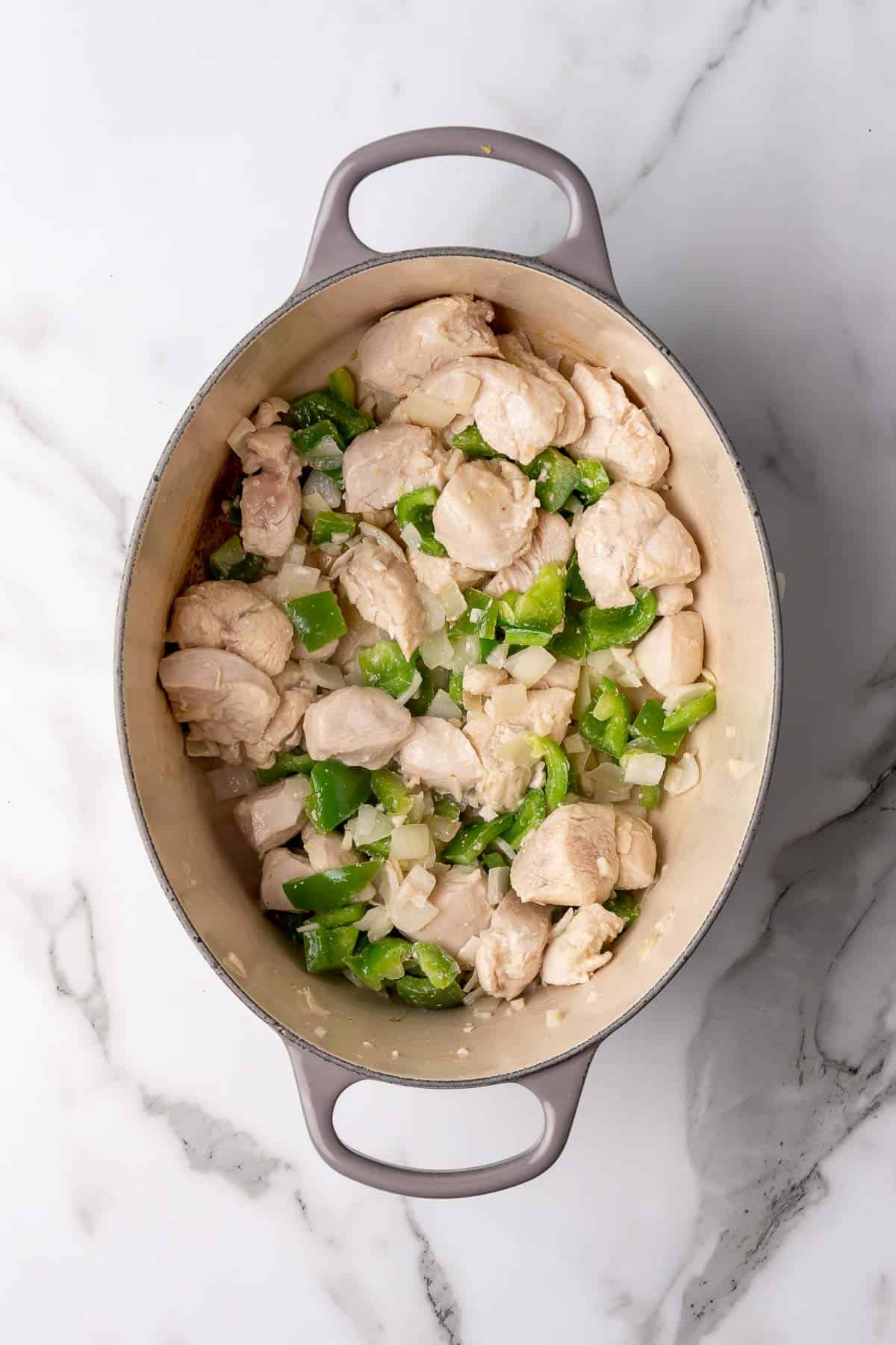 Chicken and vegetables in cooking pot