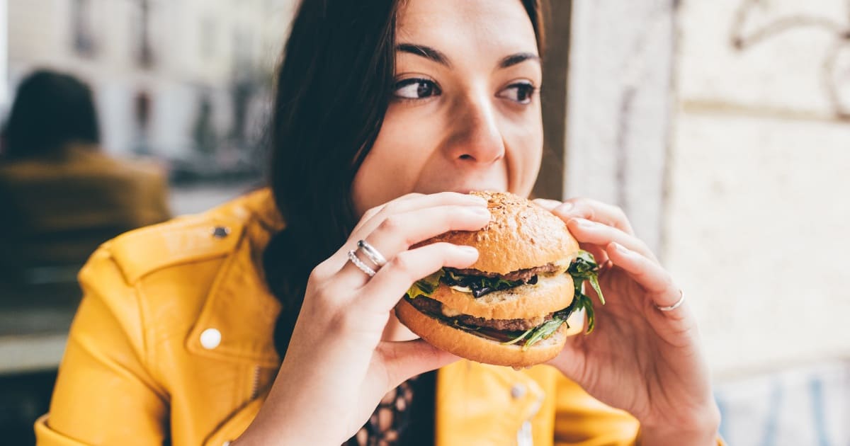 Woman eating a burger