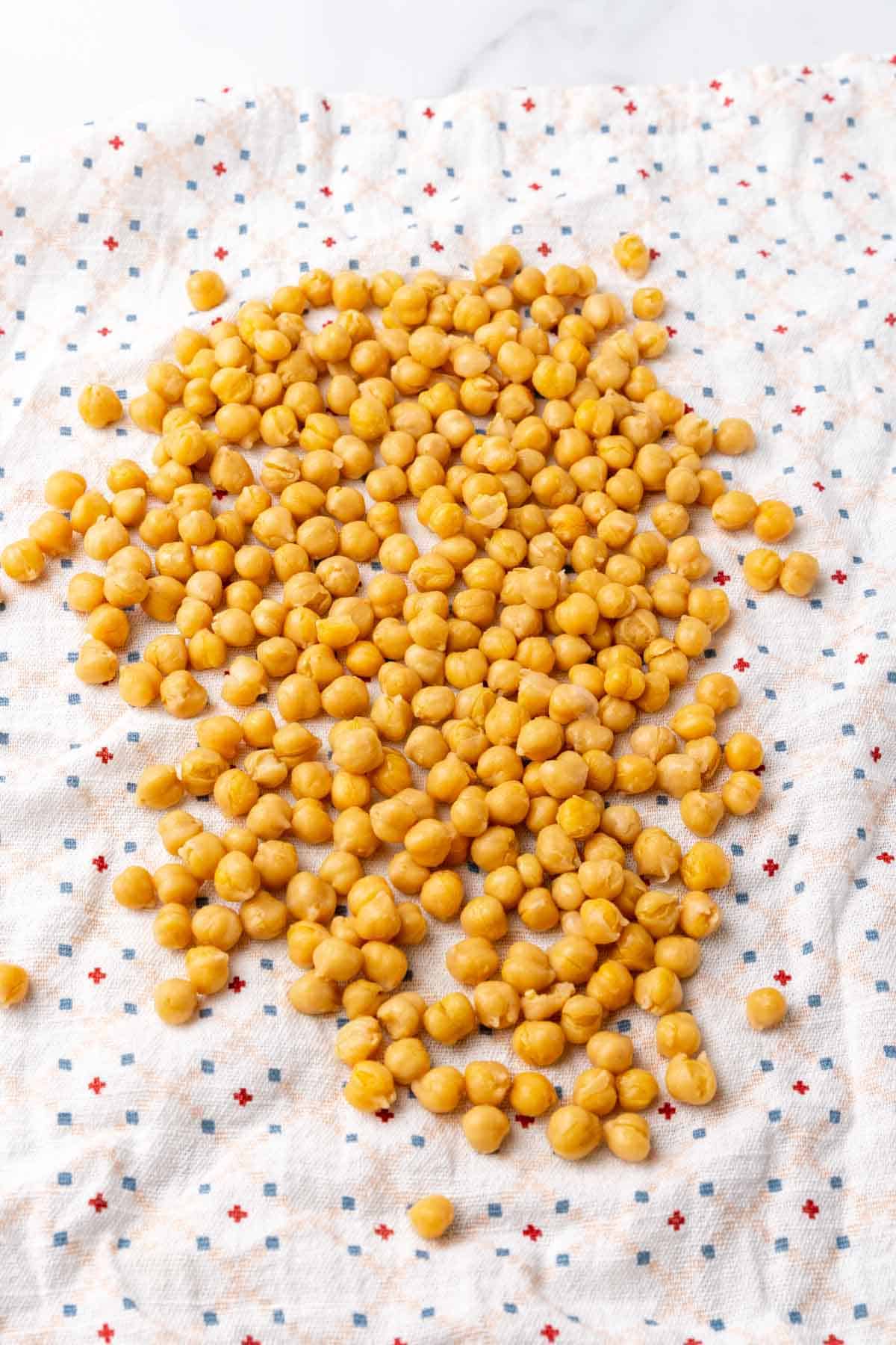 Chickpeas laid out on a cloth napkin to dry