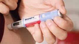 Man taking Ozempic injection