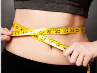 Image of person with a tape measure around their waist