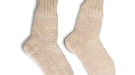 A pair of cream colored wool socks
