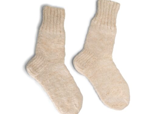 A pair of cream colored wool socks