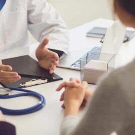 Image of a doctor explaining something to a patient