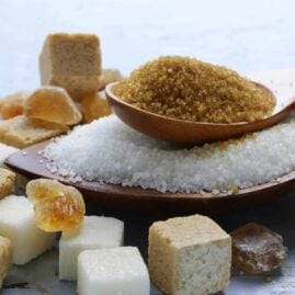 Close-up of different types of sugar piled on top of each other.