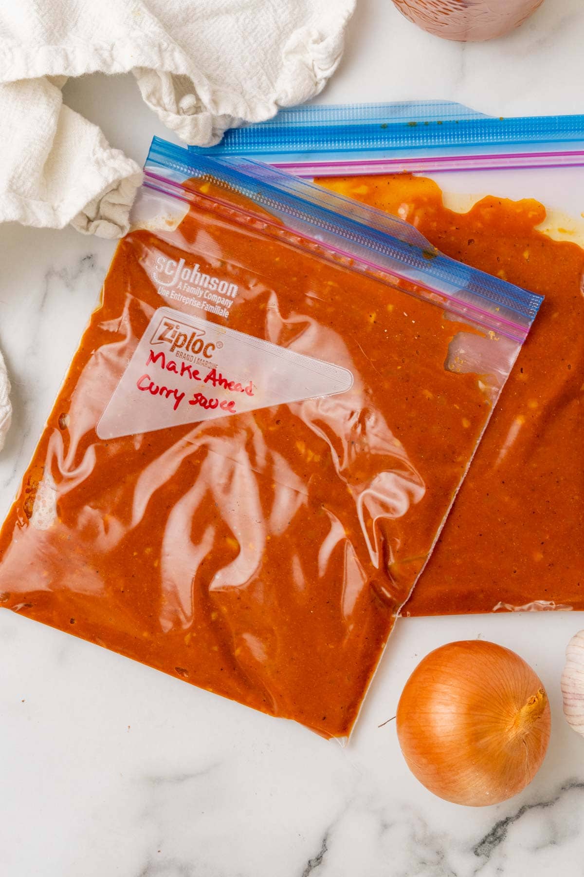 Ziploc bags with curry sauce, ready to freeze