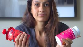 Woman holding glucose tabs and juice