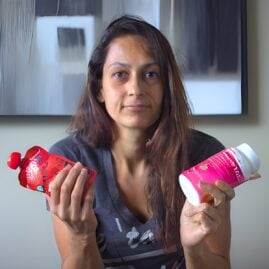 Woman holding glucose tabs and juice