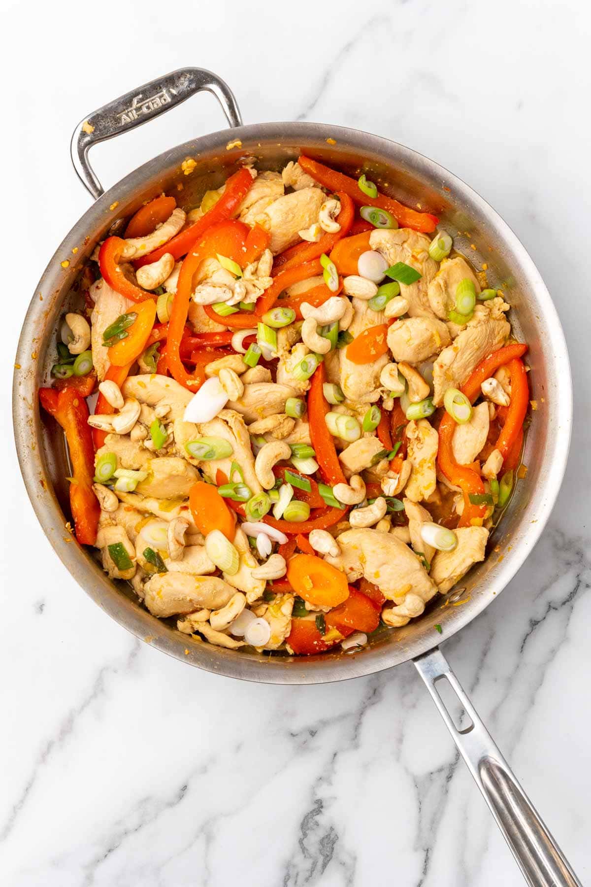 Finished chicken cashew stir-fry in a pan