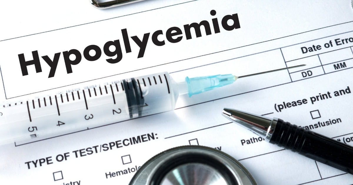 Word Hypoglycemia on diagnostic sheet with pen and syringe